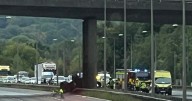 BREAKING M20 motorway closed and traffic builds as tractor falls from bridge