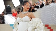 Rihanna reinvents maternity style in striped pants and bold graphic top