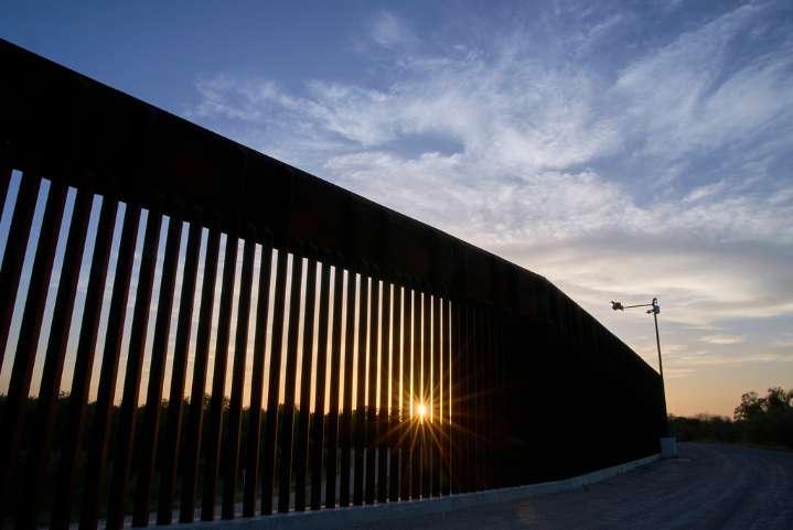 Trump wants border wall painted black so it's hotter to climb: Noem