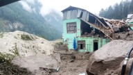 At least 56 dead & dozens missing after Himalayan flash flooding sweeps through towns leaving them caked in mud