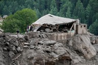 Flash floods triggered by torrential rains kill over 200 people in India and Pakistan