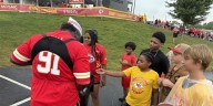 Chiefs legend Tamba Hali passes out ice cream at Training Camp