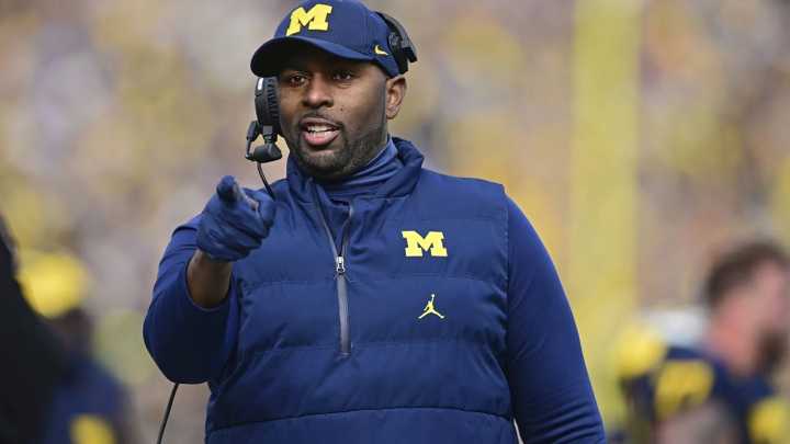 Michigan faces heavy NCAA sanctions; Coach Moore suspended but available for Oklahoma game