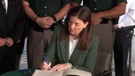 Ceremonial bill signing of N.H. law honors fallen officer, expands 'move over' protections