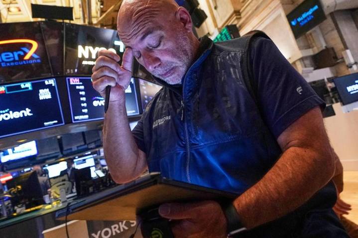 Wall Street holds steady following mixed profit reports from McDonald’s, Disney and Shopify
