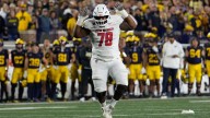 New Mexico lineman runs from fight after brief skirmish with Michigan player