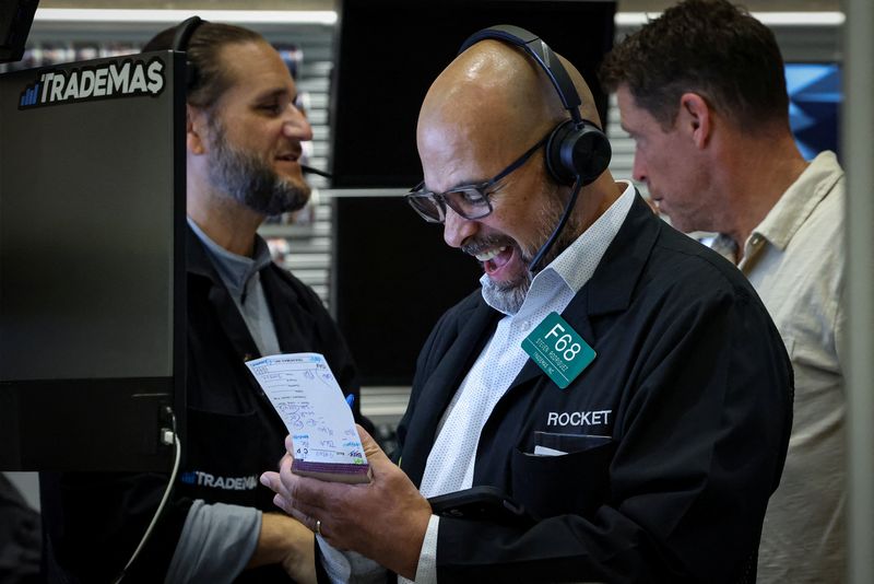Dow scales record high on hopes of Fed rate cuts, trade deals