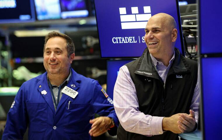 Dow notches record high as Wall Street cheers Powell’s speech