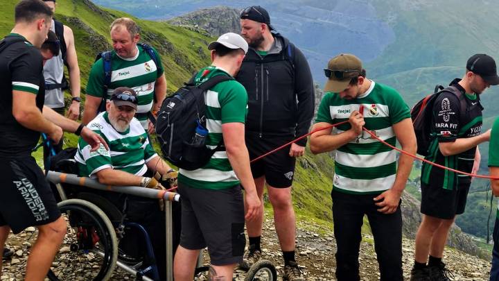 #TheMoment a rugby team carried a friend in a wheelchair up a mountain