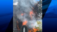 House fire sends smoke billowing into air in Woonsocket