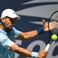Djokovic fights off qualifier to make US Open third round