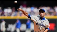 Ichiro Suzuki throws first pitch to Randy Johnson at Mariners game
