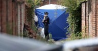 Man arrested on suspicion of manslaughter after body found in Moss Side alleyway