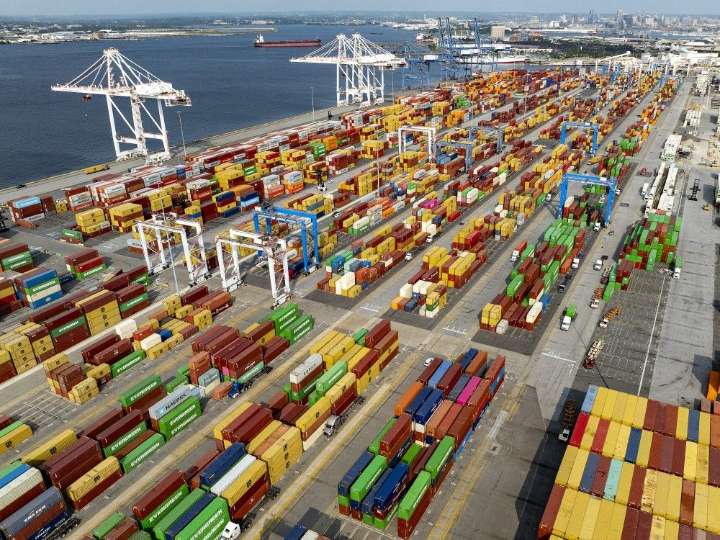 Trump's tariffs go into effect as US economic pain surfaces