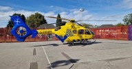 LIVE: Air ambulance lands in Manchester park as police descend on street