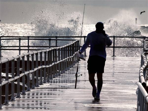 Hurricane Erin picks up steam as it edges along the East Coast