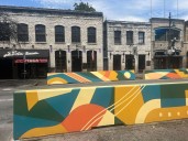 Meet the artist behind the mural on the new 6th Street concrete barriers