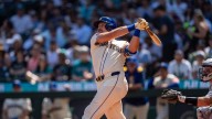 Cal Raleigh hits his 48th, 49th homers to set MLB season mark for catchers, passing Salvador Perez