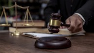 Former Goldman, JPMorgan exec charged with gambling away investor funds