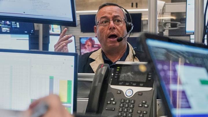 Stocks pull back from their latest all-time highs on Wall Street