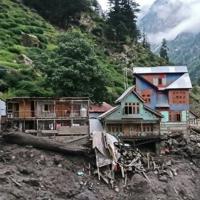 Indian rescuers scour debris after 60 killed in flood