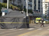 Shots ring out, woman found dead in SUV on Jasper Ave.: Edmonton police