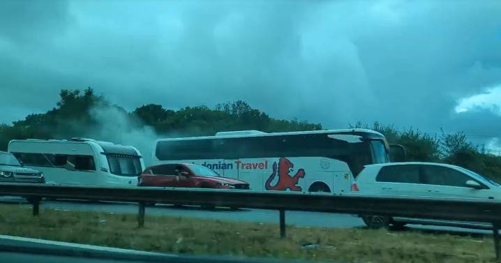 Live: M5 traffic after smoke pours from coach