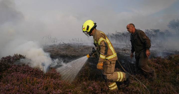 Crews battling a wildfire in English countryside face added risk of hidden WWII
