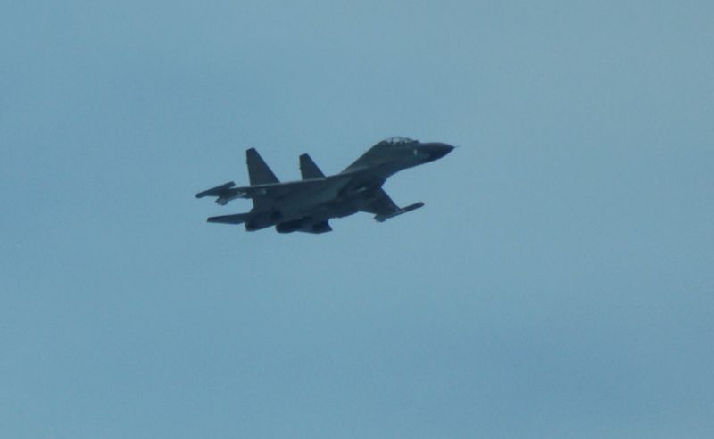 Chinese fighter 'intercepts' Philippine plane over disputed shoal, Manila says