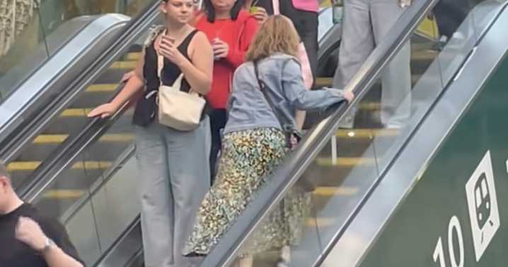 Edinburgh Waverley commuters baffled as woman struggles up the down escalator