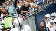 Geno Smith, Maxx Crosby flip off Seahawks fan