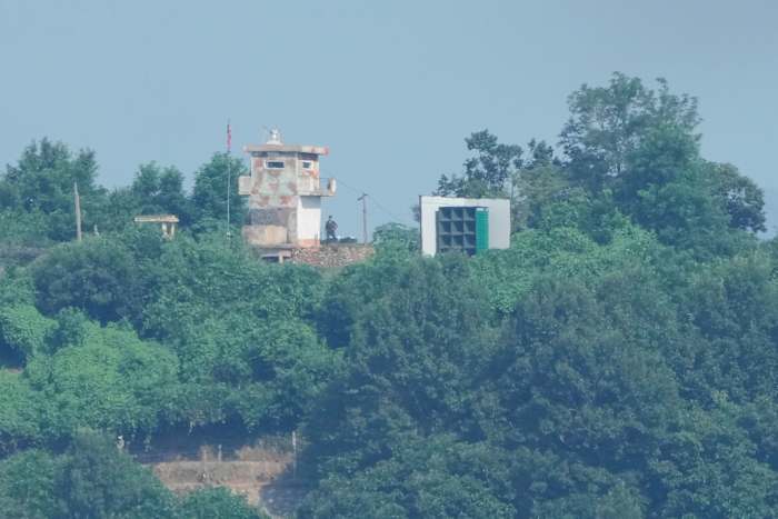 Powerful sister of North Korean leader denies removal of frontline speakers