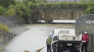 Torrential rains in southern Japan cause flooding, mudslides and travel disruptions