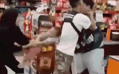 Terrifying moment knife-wielding maniac attempts to kidnap baby boy after being caught shoplifting in failed heist