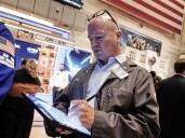 Wall Street edges higher, pushes S&P 500 to another record