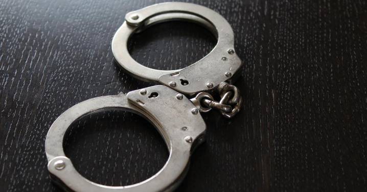Man accused of throwing chair at officers at police station