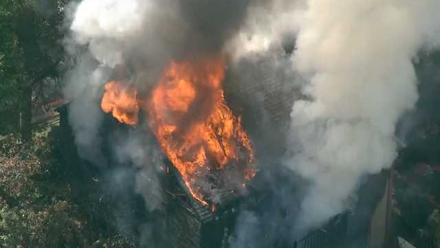 Resident jumps from balcony to escape large fire at Mass. home