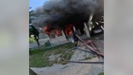 Child trapped in house fire jumps into arms of NJ officer