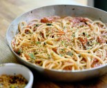 Gretchen’s table: Bucatini with burst cherry tomatoes and fried caper crumbs offers ample flavor