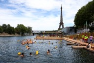 With the Seine open for swimming in Paris, tourists and residents embrace it as temperatures soar