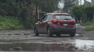 Afecta movilidad baches y calles fangosas en colonia La Candelaria