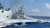 Moment Chinese ships smash into each other while chasing vessel in latest clash in South China Sea