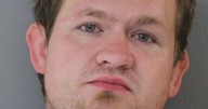 Man fled into oncoming lanes of traffic after ramming police vehicles, records say