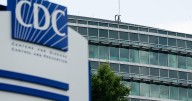 CDC staff reel from shooting, harassment, vaccine panel and mass layoffs