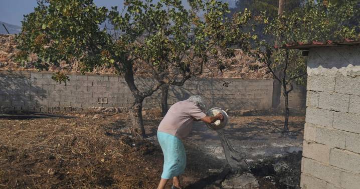Photos of burning wildfires in Greece