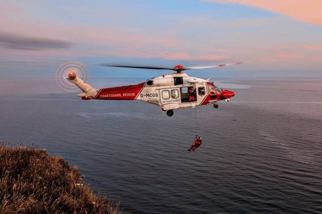 Woman blown out to sea still clinging to inflatable crocodile off Scottish coast