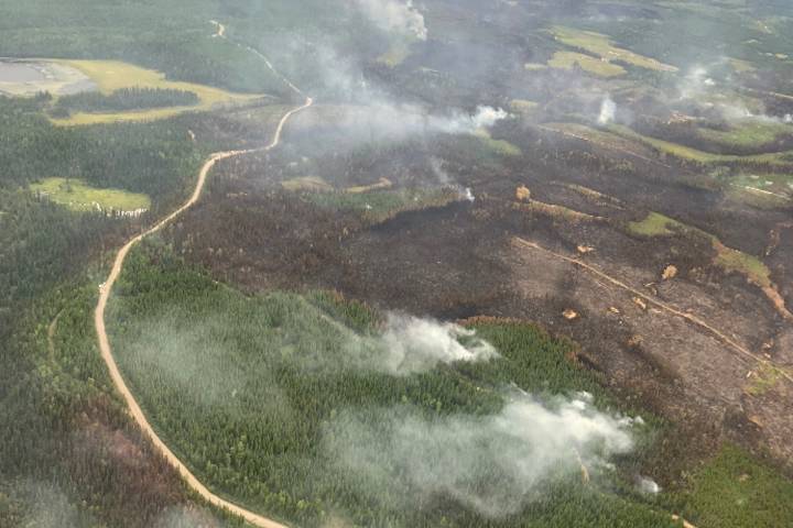 Snaking River wildfire west of Quesnel being held, evacuation alerts lifted
