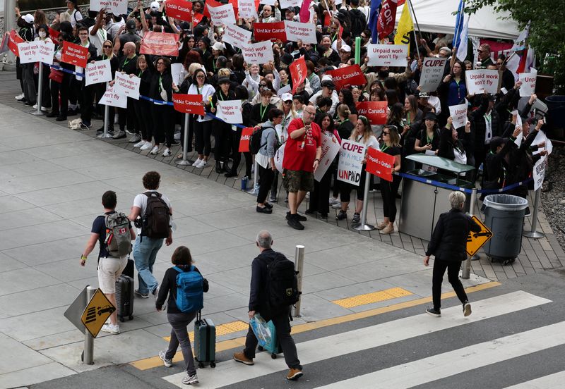Striking Air Canada flight attendants defy back