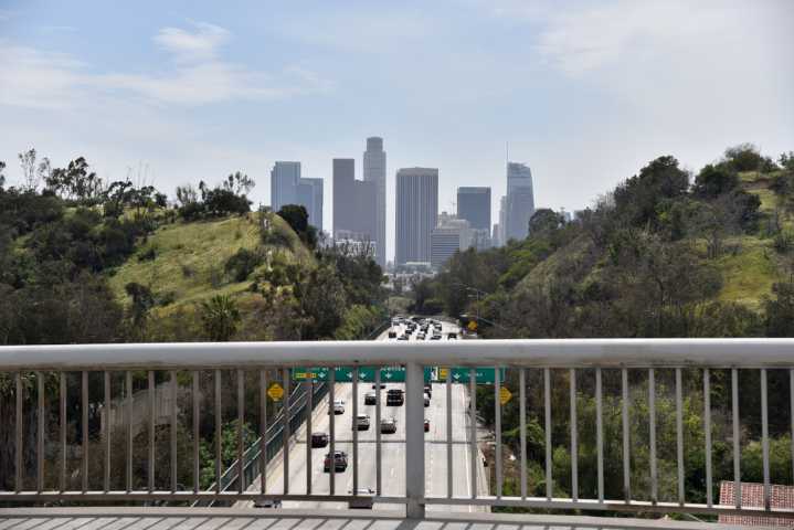 Woman dies after dangling off 110 Freeway in Highland Park
