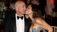 Lauren Sánchez & Jeff Bezos' Awkward PDA Moments Are About As Fake As Her Plastic Surgery